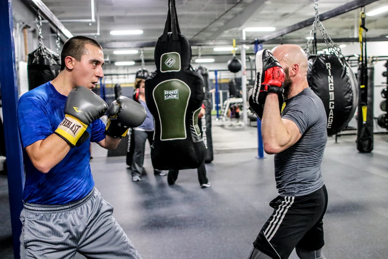 Two students practicing striking together