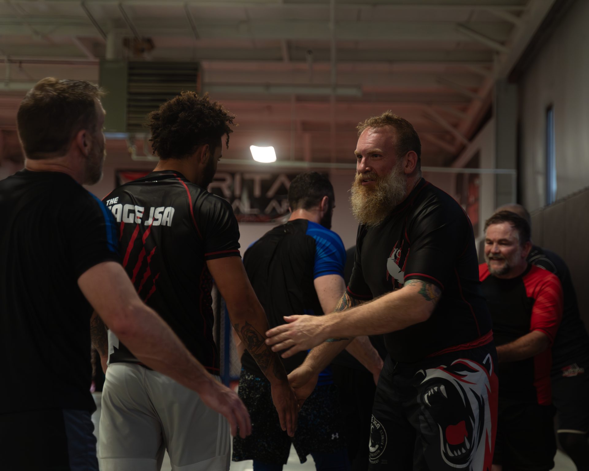 Training partners shaking hands after rounds