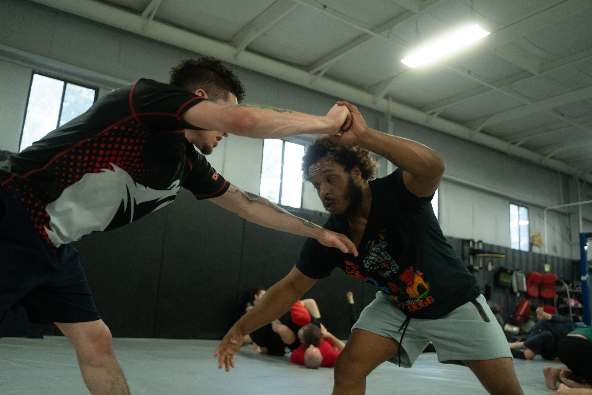 Pairs working at the same time across the mat during class