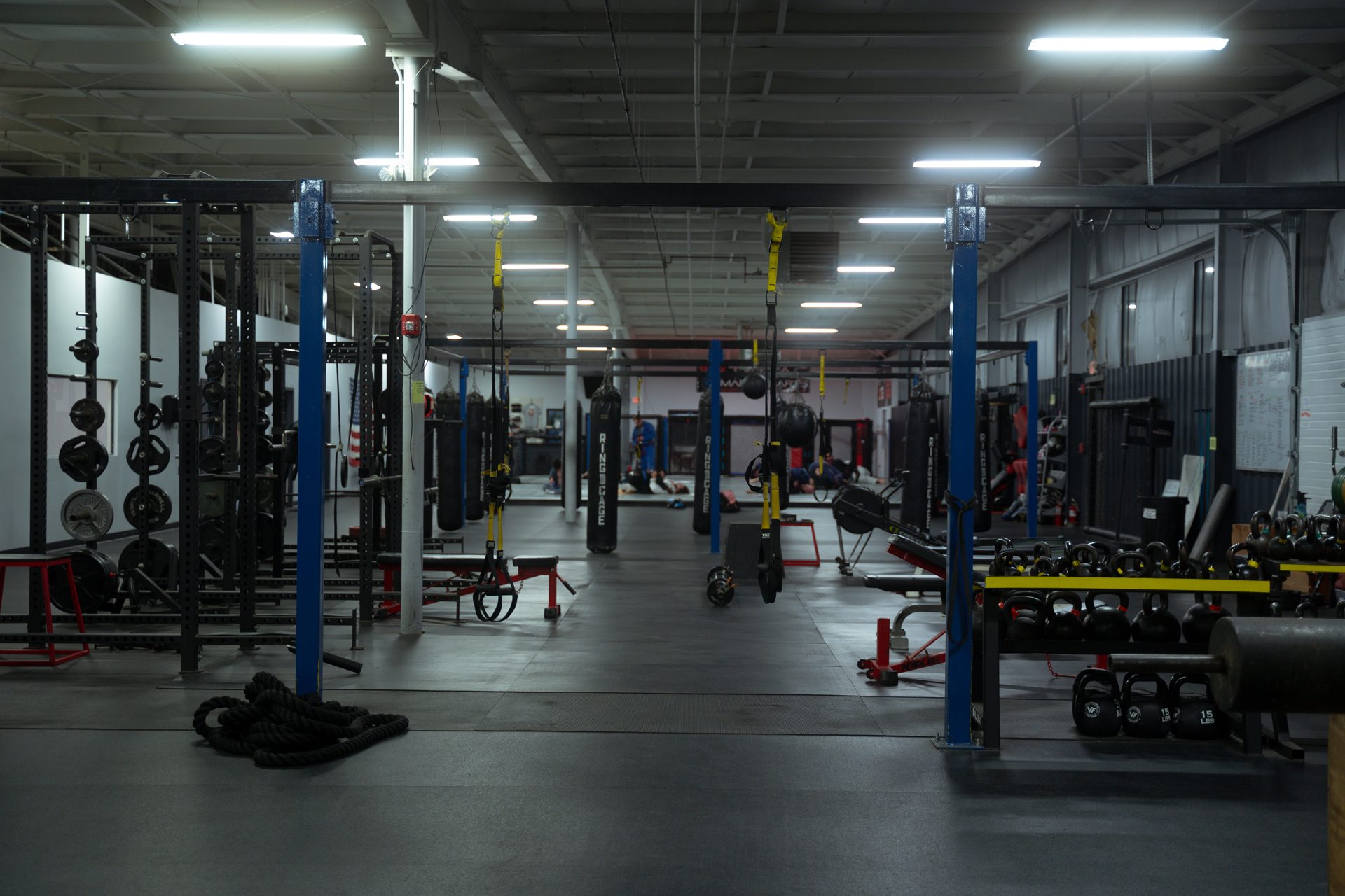The Cromwell training floor: racks, bags, and the cage at the back